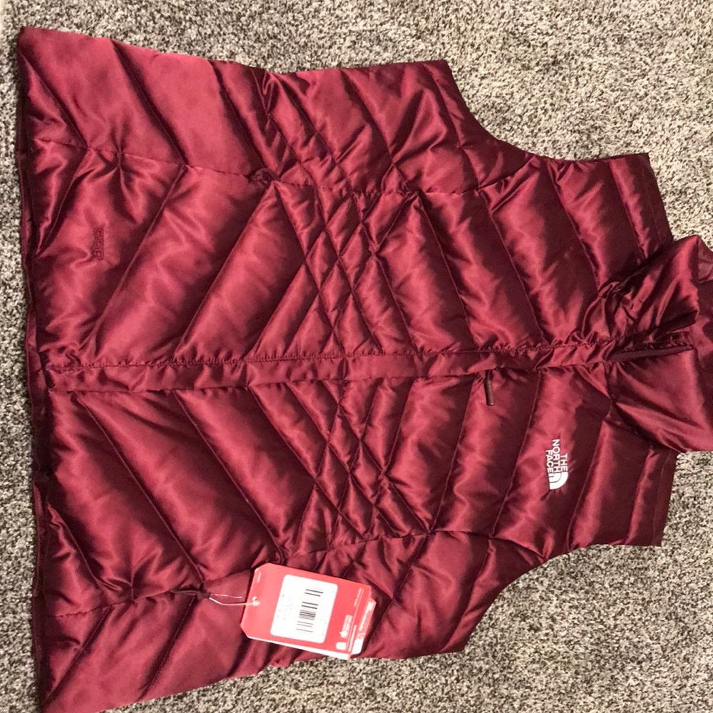 Never worn, tags still attached. Size Large